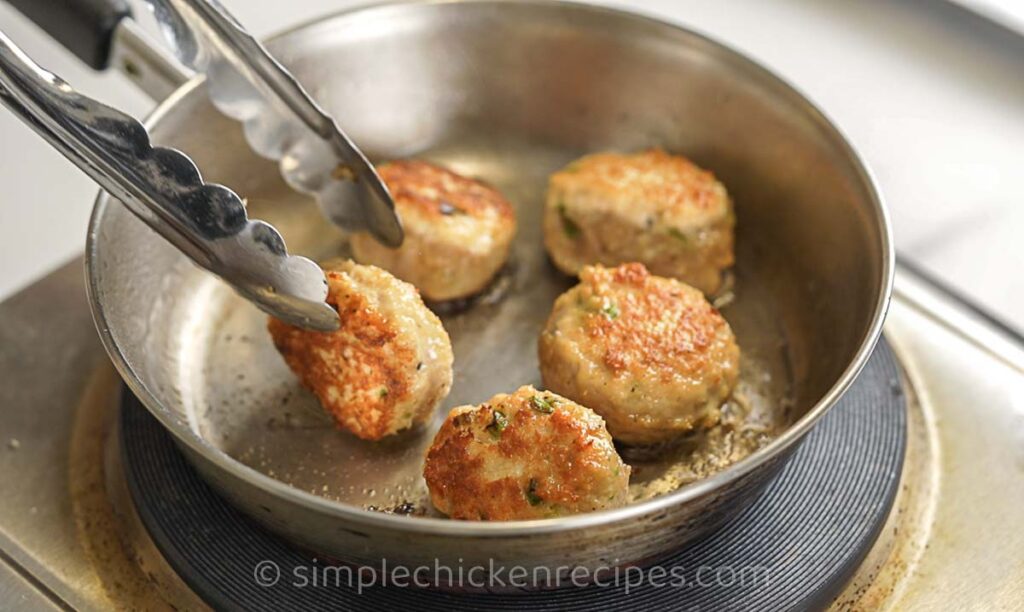 frying meatballs in a pan
