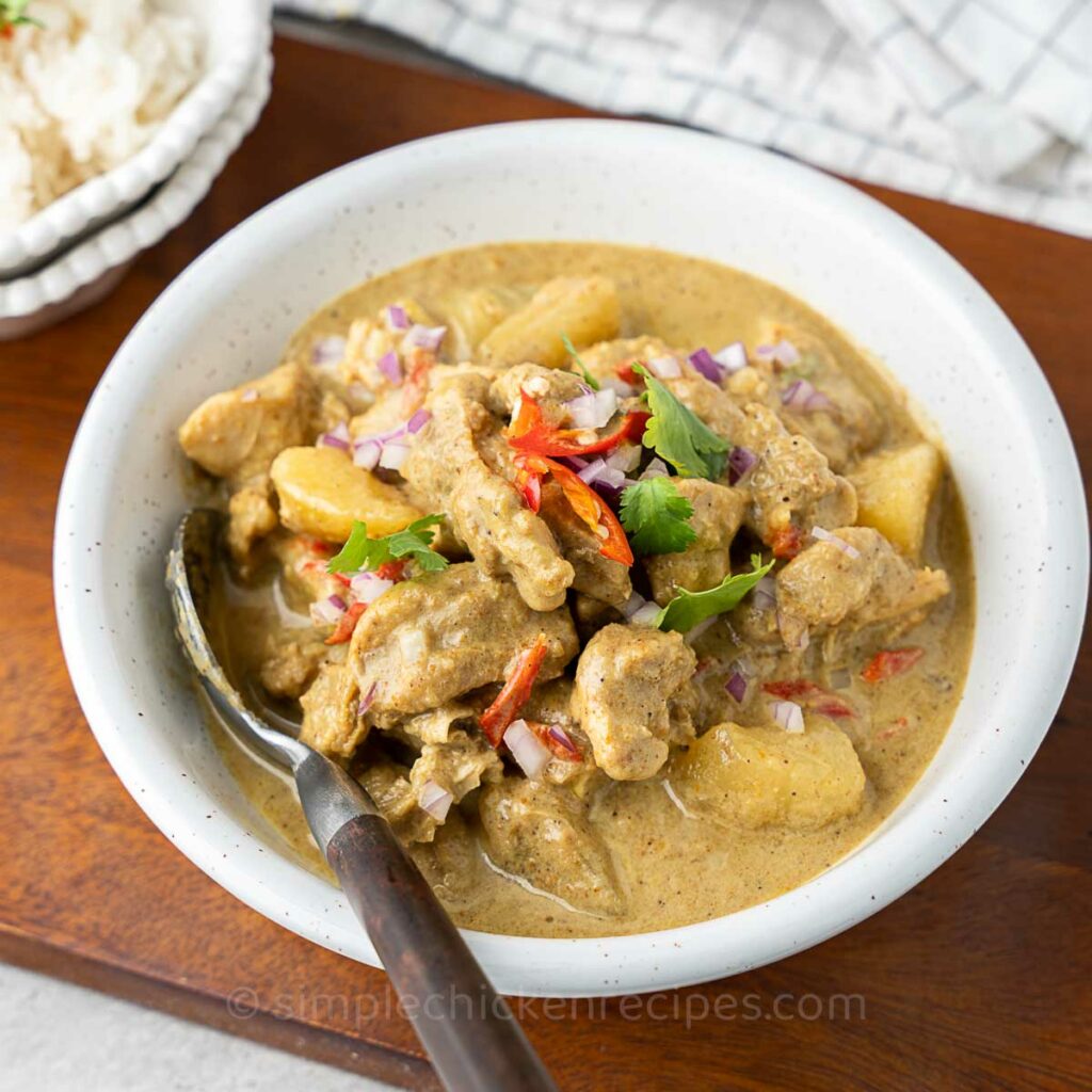 chicken and potato curry in a bowl.